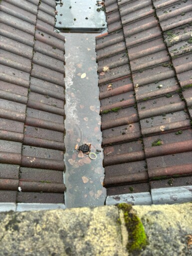Roof valley blocked with debris